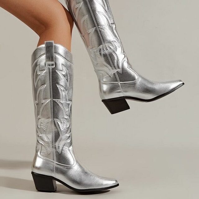 Step into the spotlight with a pair of dazzling silver knee-high boots.